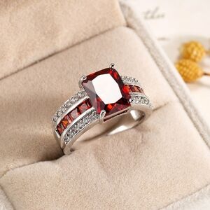 Radiant Silver Ring with Red Gemstone